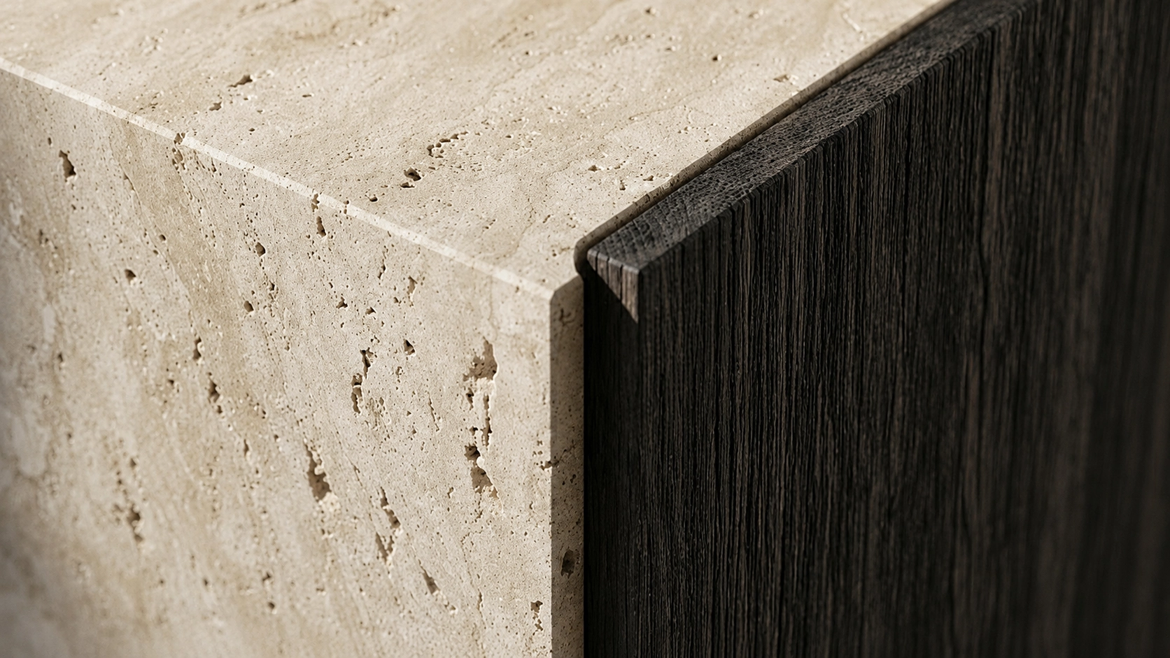 Raw honed travertine intersecting with dark, wire-brushed oak in raking natural light.
